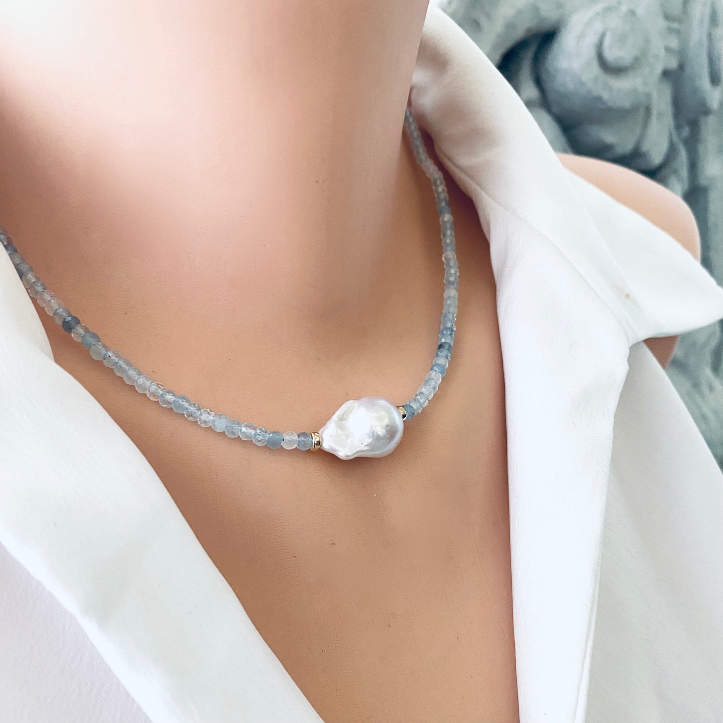 Aquamarine pearl necklace on mannequin, detailed gemstone view