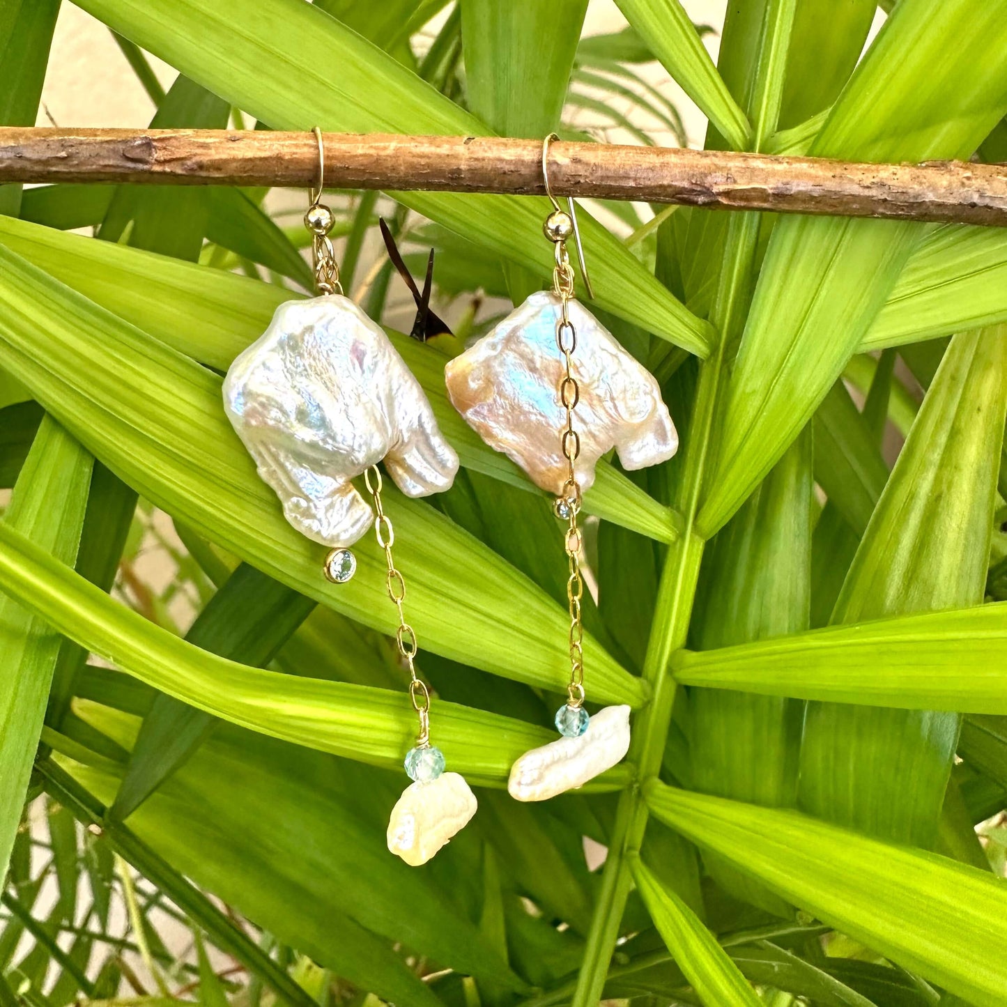 Boho pearl earrings gold filled displayed outdoors with leafy green backdrop — keshi square pearls and blue gemstones by Loulia Pearl Jewelry