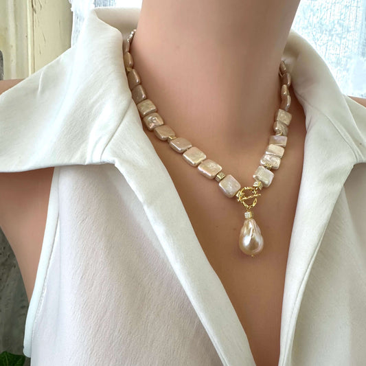 Side angle of golden baroque pearl toggle necklace on mannequin — elegant handcrafted pearl jewelry with gold clasp by Loulia Pearl Jewelry