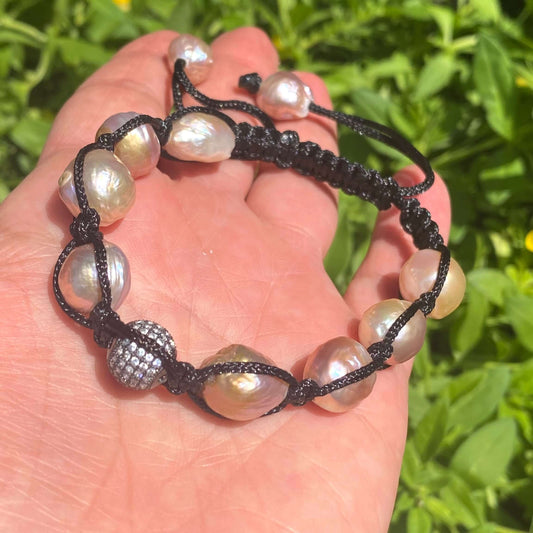 Baroque pearl bracelet featuring pastel baroque pearls and black thread, showcasing a modern and feminine design.