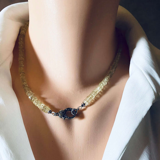 Lemon quartz beaded necklace with oxidized silver pavé clasp displayed on a mannequin against a white shirt.