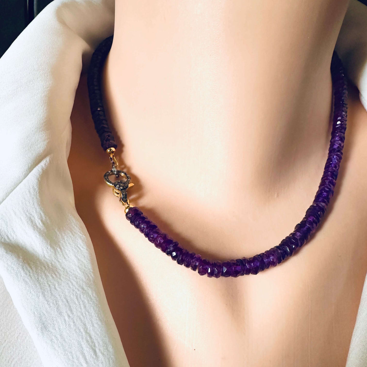 Purple Amethyst Gemstone Necklace with Diamond Pavé Gold Vermeil Clasp showcased on a mannequin's neck.