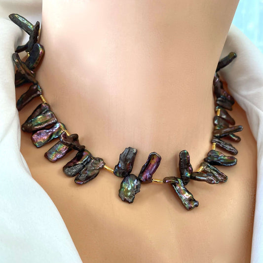 Black pearl choker necklace worn on model, peacock Biwa stick pearls with iridescent luster