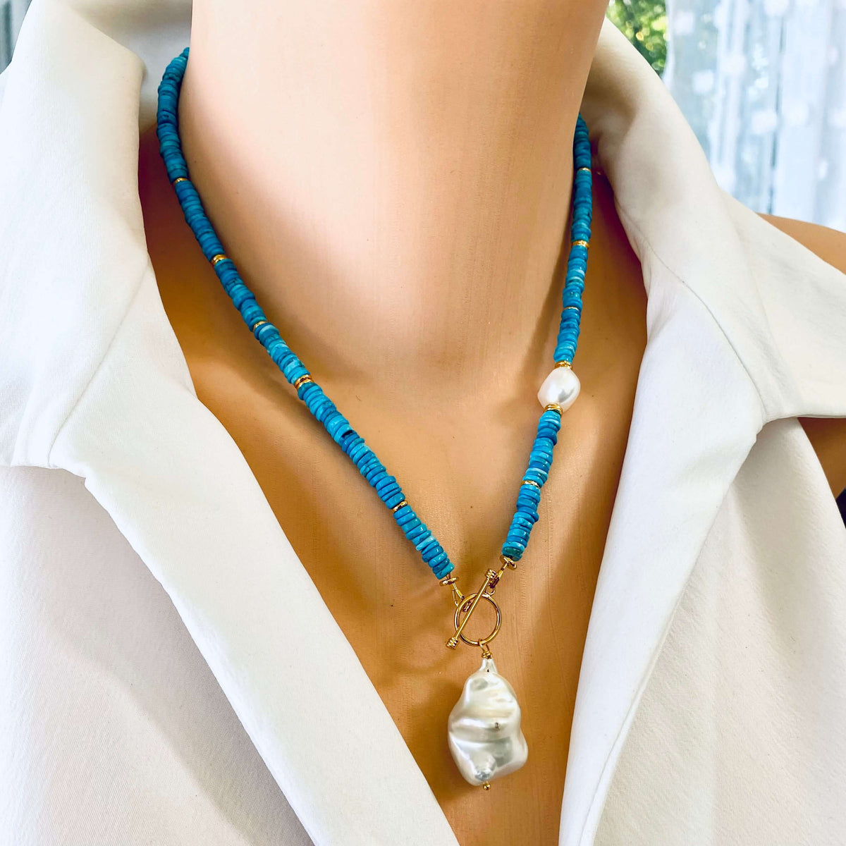 Turquoise Pearl Toggle Necklace showcasing vibrant turquoise beads and baroque pearl on a mannequin neck.