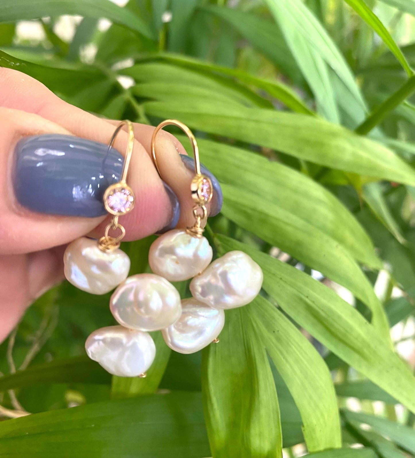 Elegant earrings composed of Natural Keshi pink and white pearls hanging from gold filled hooks with pink cubic zirconia bezel
