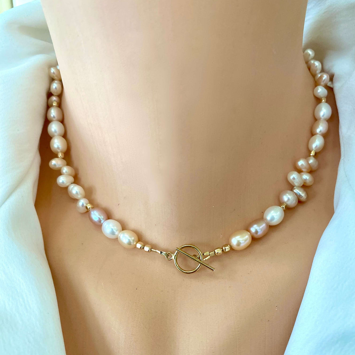 Pearl toggle necklace with pastel pearls and 14K gold filled clasp, showcasing its elegant design and natural beauty.