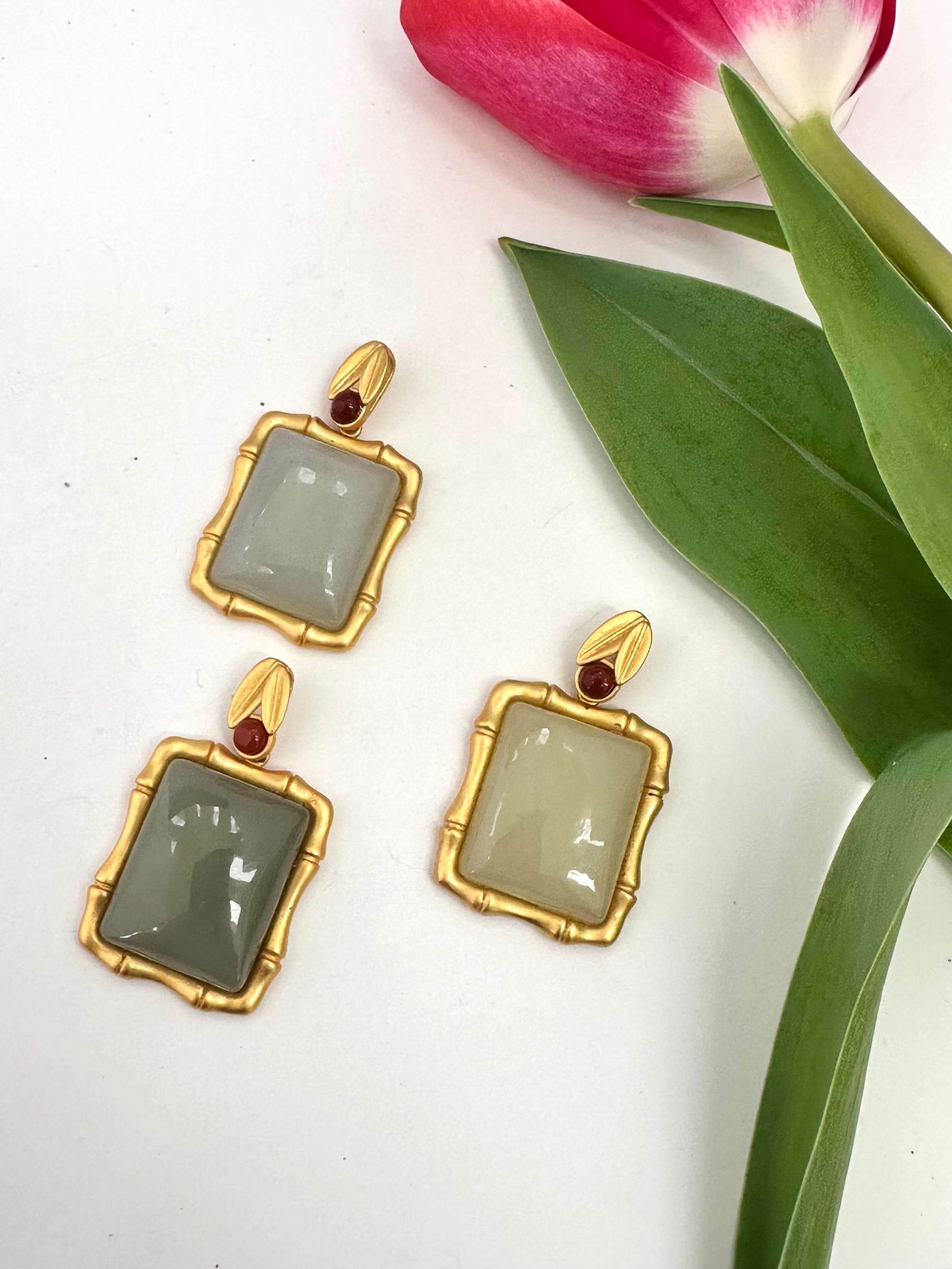 Bamboo style jade pendant with red agate in gold vermeil, featuring three unique jade pieces with agate accents.