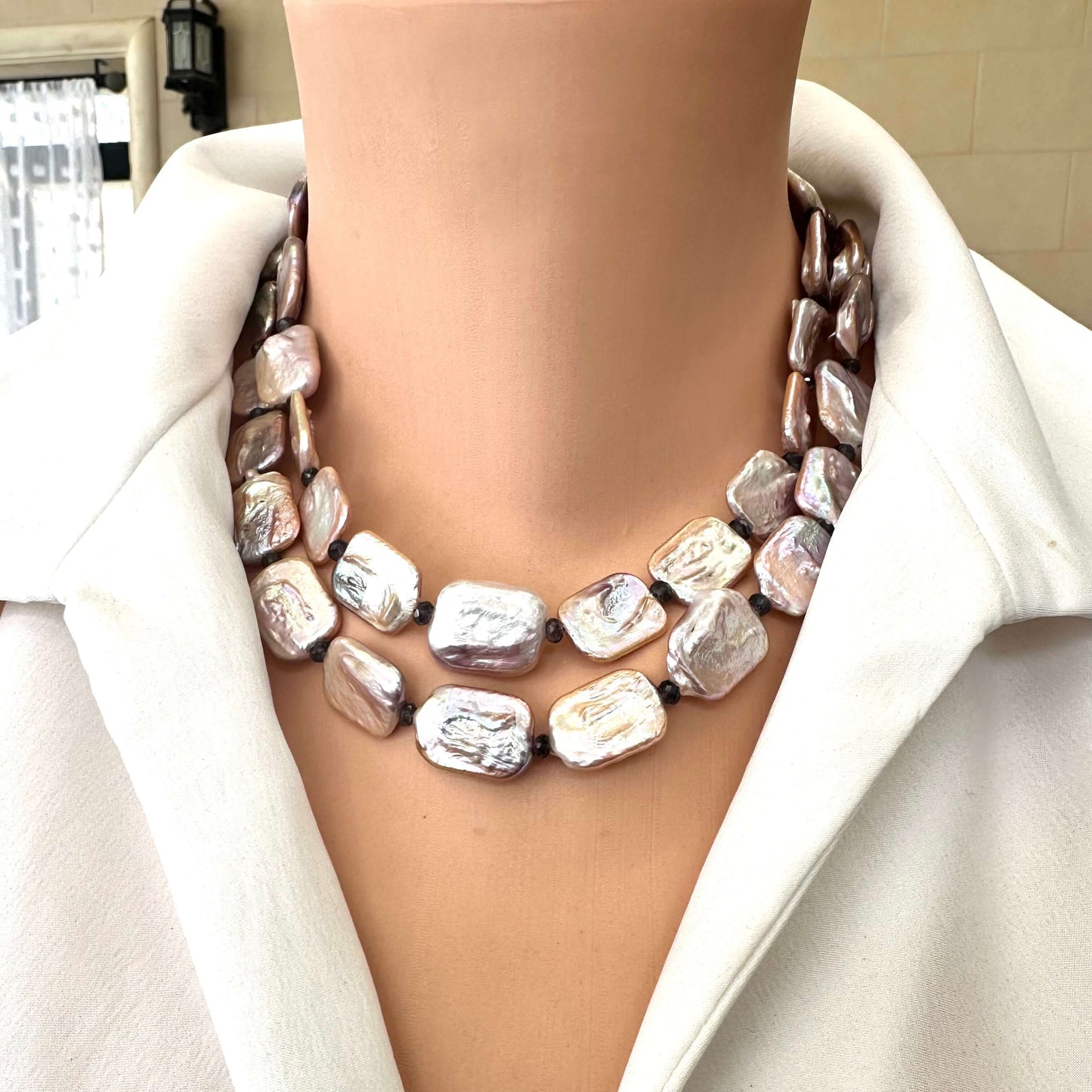 Front view of Statement Pearl Necklace showcasing purple pink pearls and navy iolite gemstones with gold magnetic clasp.