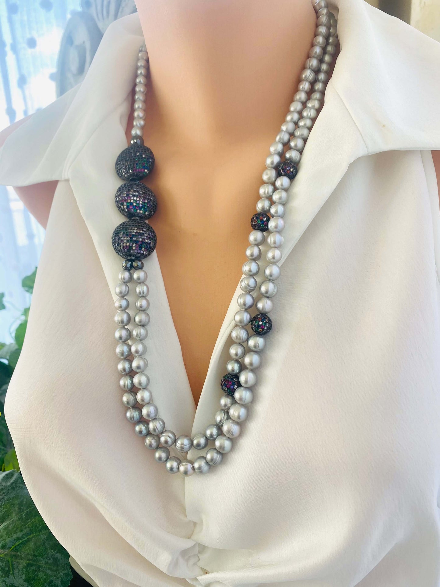 Grey Pearl Necklace with double strands of freshwater pearls shown in side view on mannequin.