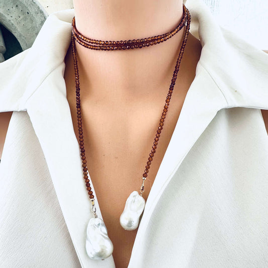 Hessonite Garnet and Baroque Pearl Lariat Necklace worn choker style on mannequin in white blouse, designed and handmade in Canada.