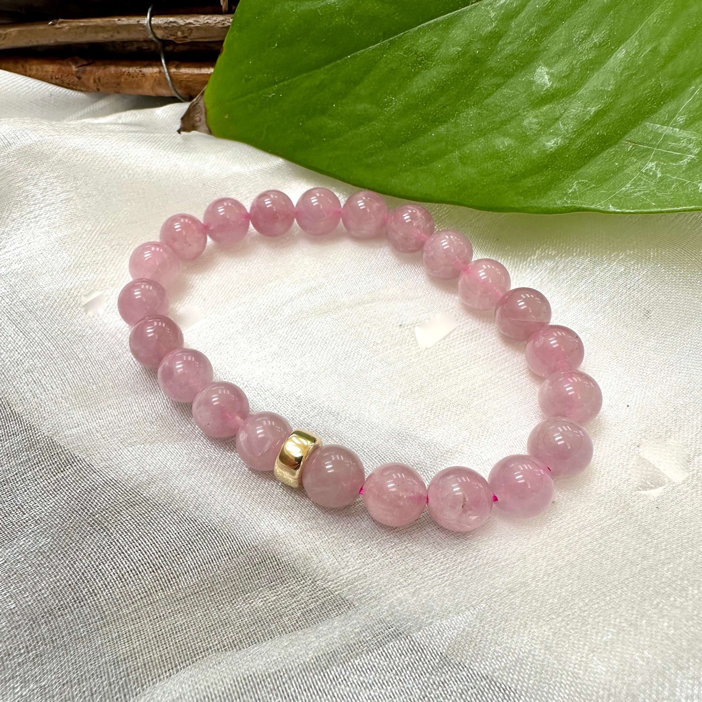 Rose Quartz Pearl Bracelet close-up on white cloth – gemstone and pearl detail