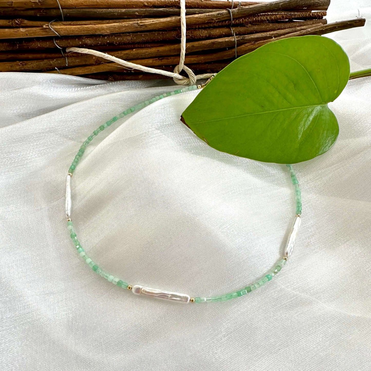 Green Chrysoprase Necklace displayed on white cloth – product detail close-up