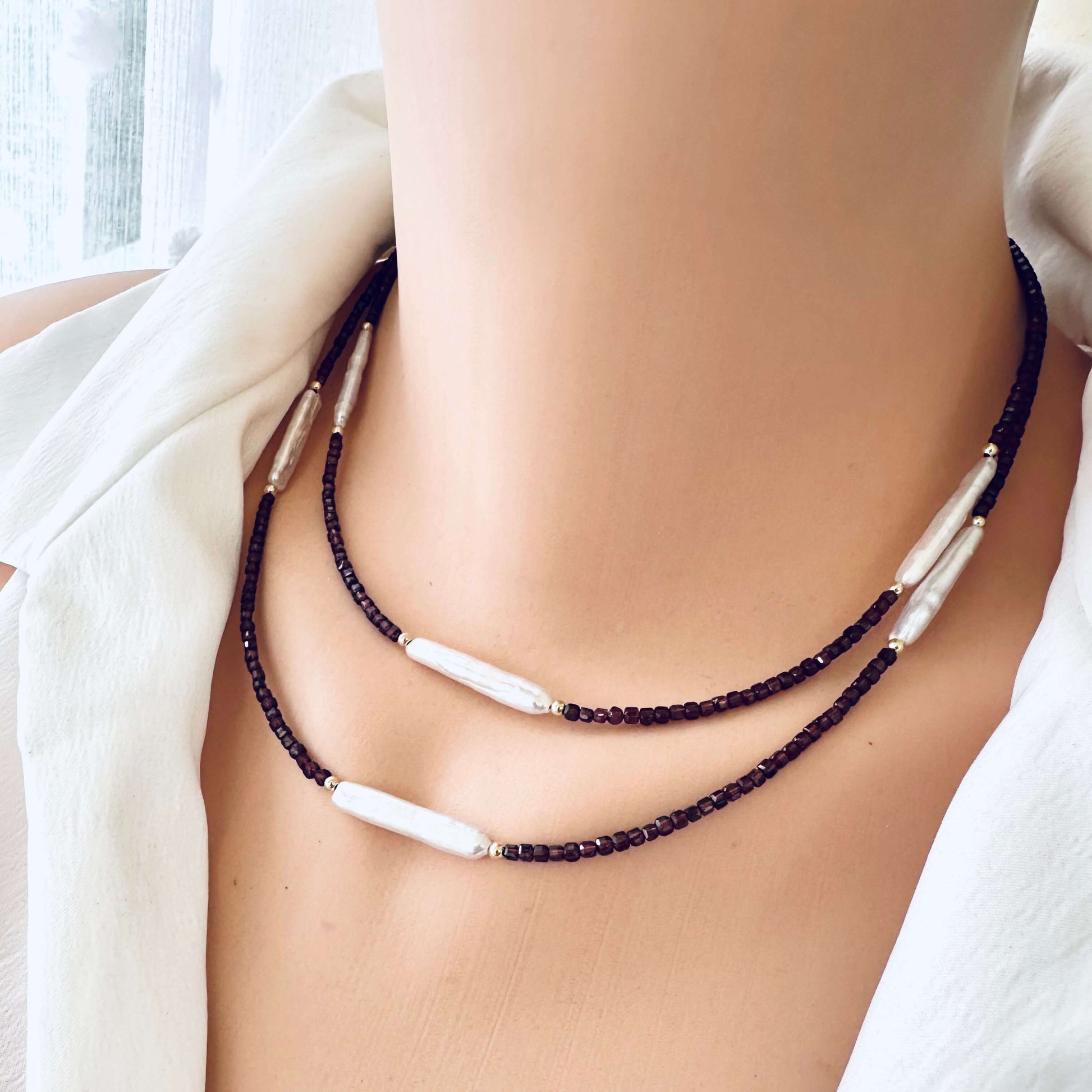 Garnet Pearl Necklace on mannequin – double wrap style – gold filled accents