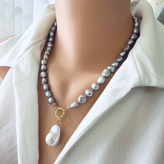 Grey pearl necklace featuring silver-grey freshwater pearls with a striking white baroque pearl pendant.