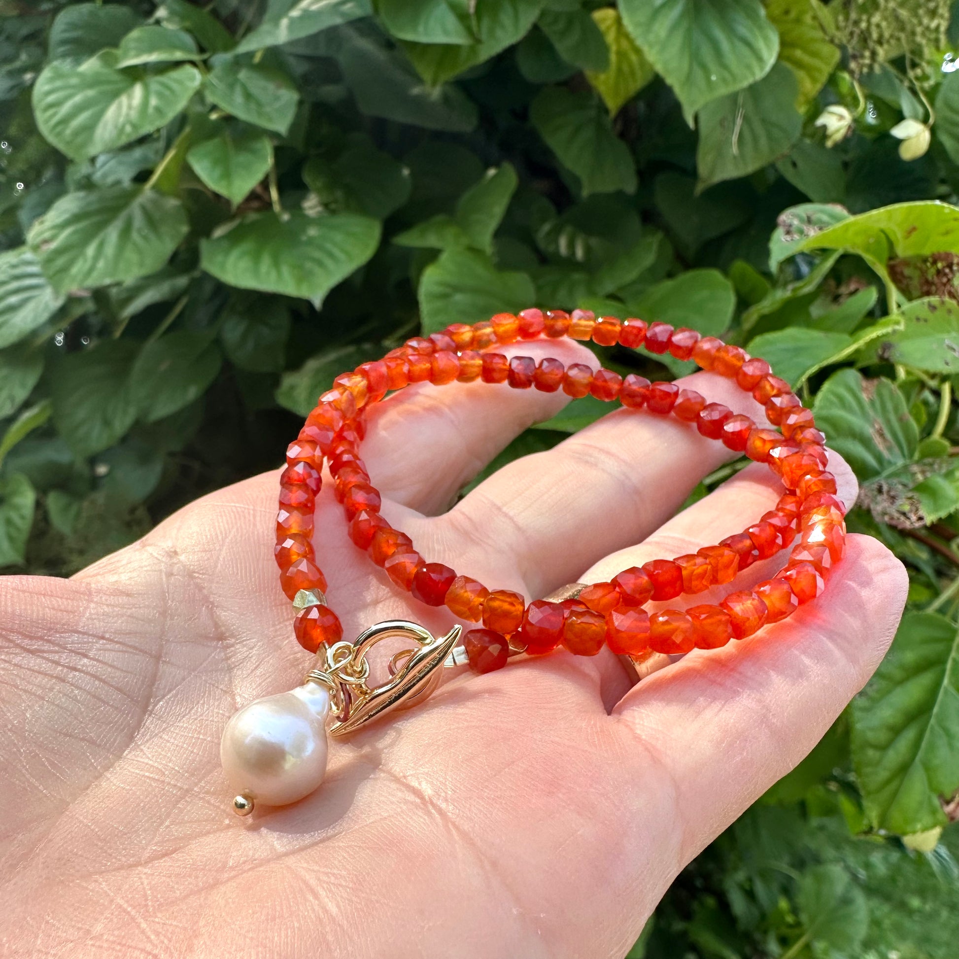 Carnelian toggle necklace with baroque pearl showing gold plated toggle clasp and pearl charm