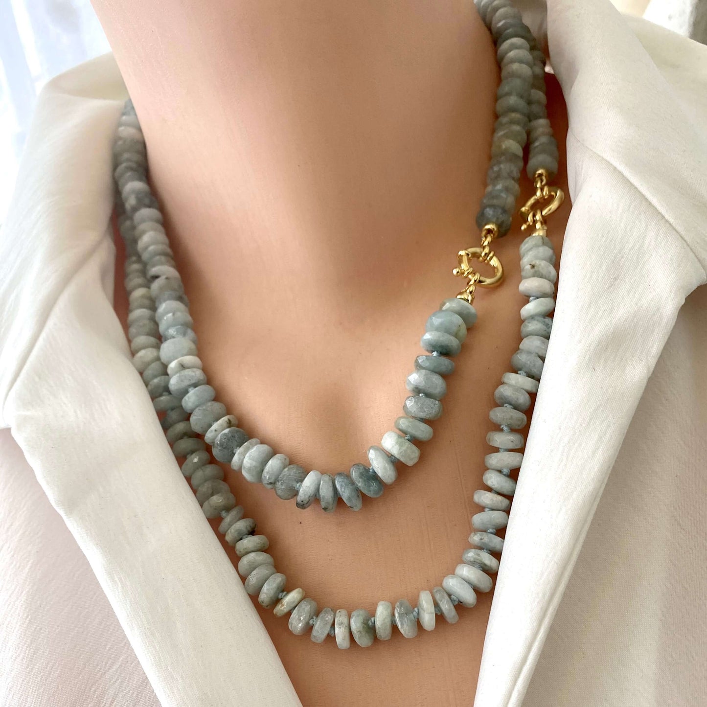 Aquamarine beaded necklace worn on mannequin, front close-up