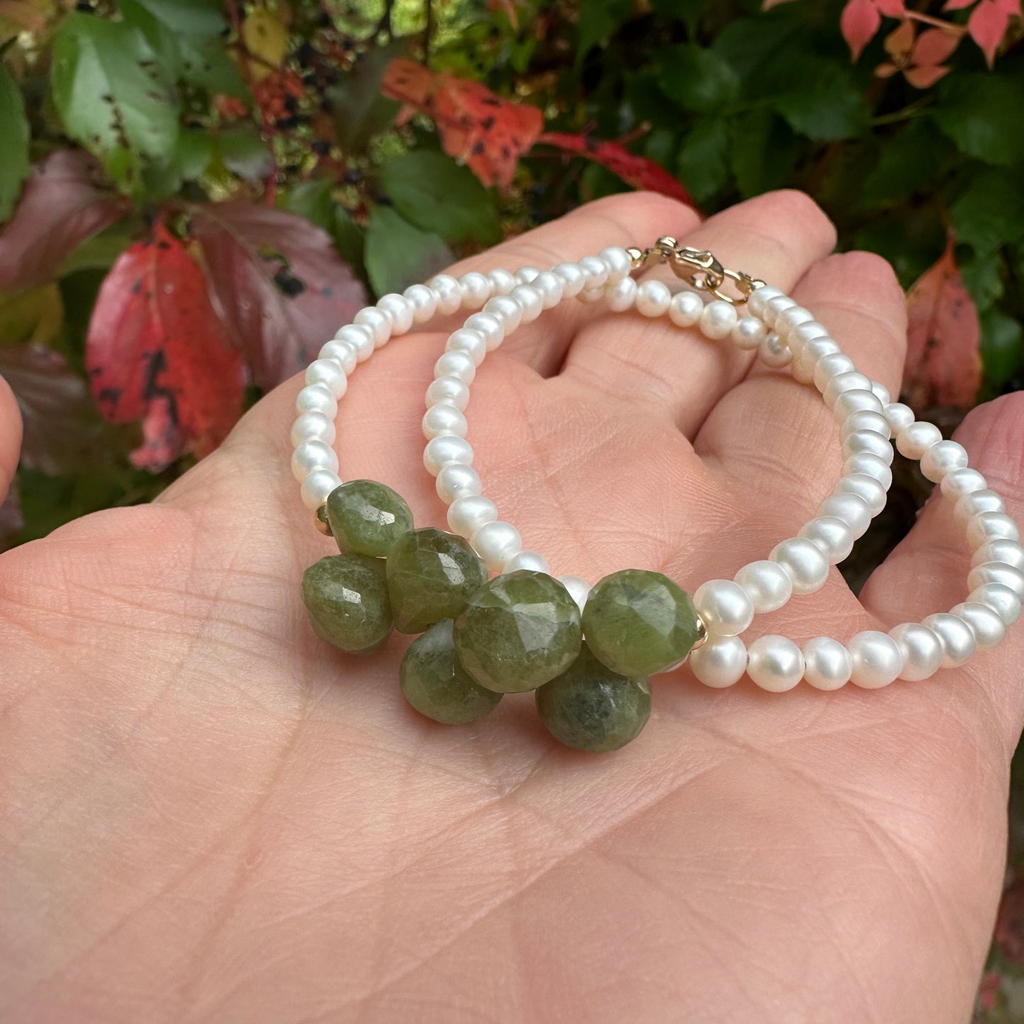 Double wrap pearl bracelet featuring creamy pearls and olive green Vesuvianite gemstones.