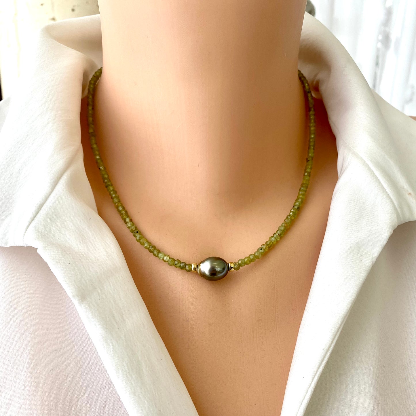 Peridot Baroque Pearl Necklace featuring vibrant green Peridot beads and a bold Tahitian Baroque pearl design.