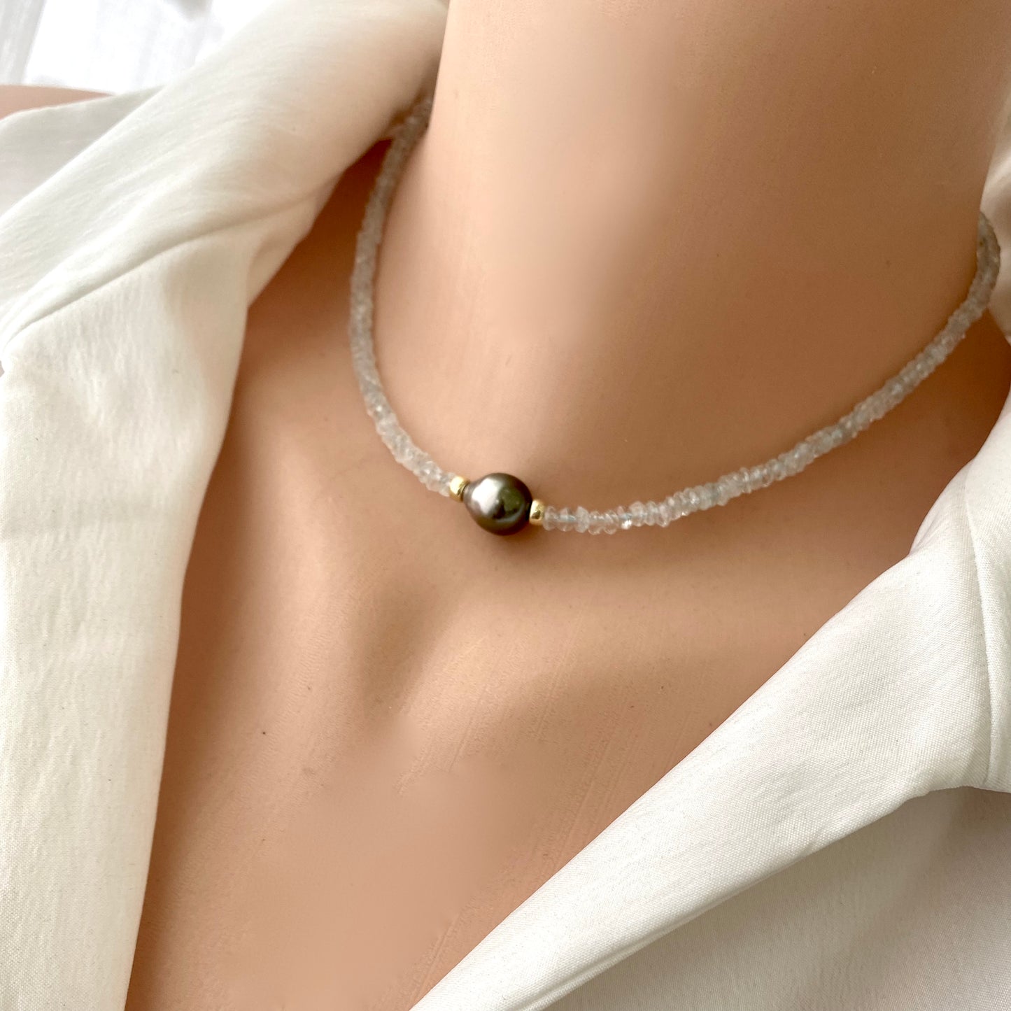 Aquamarine tahitian baroque pearl necklace showcasing light-blue aquamarine and a bold tahitian baroque pearl.