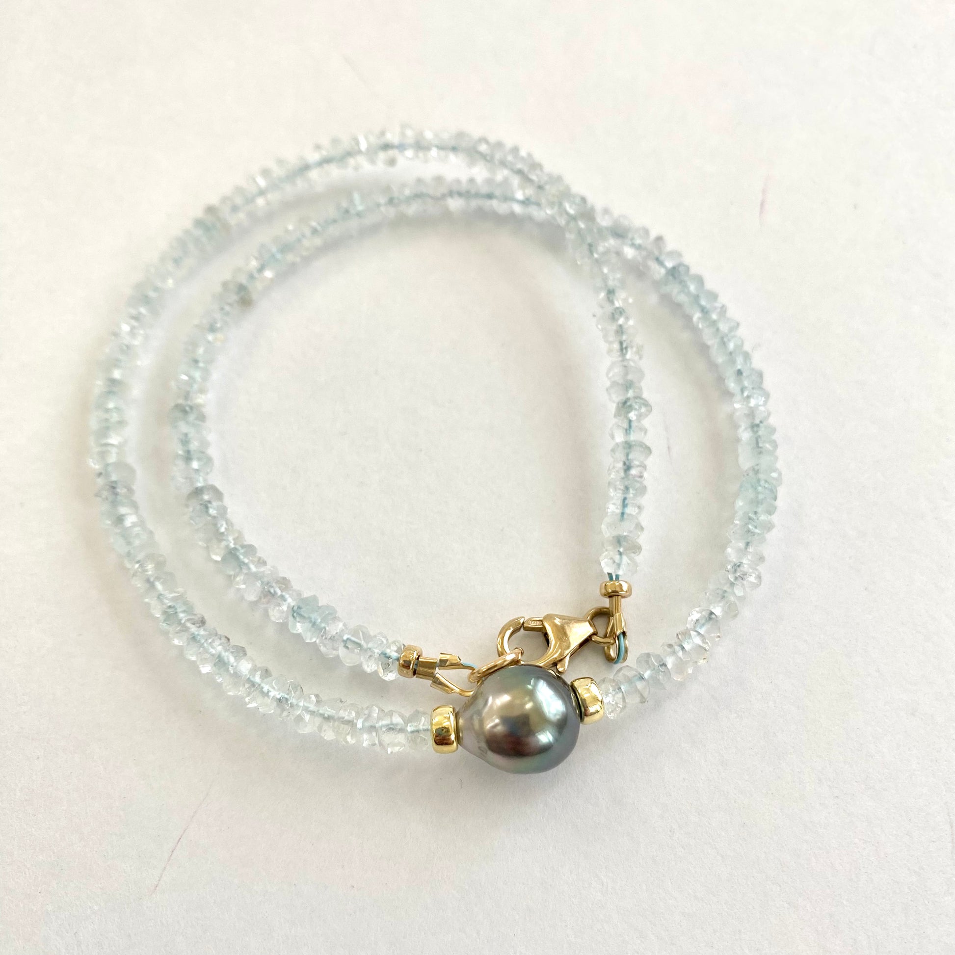 Aquamarine Tahitian Baroque Pearl Necklace | Choker Design featuring light-blue gemstones and a Tahitian Baroque pearl.