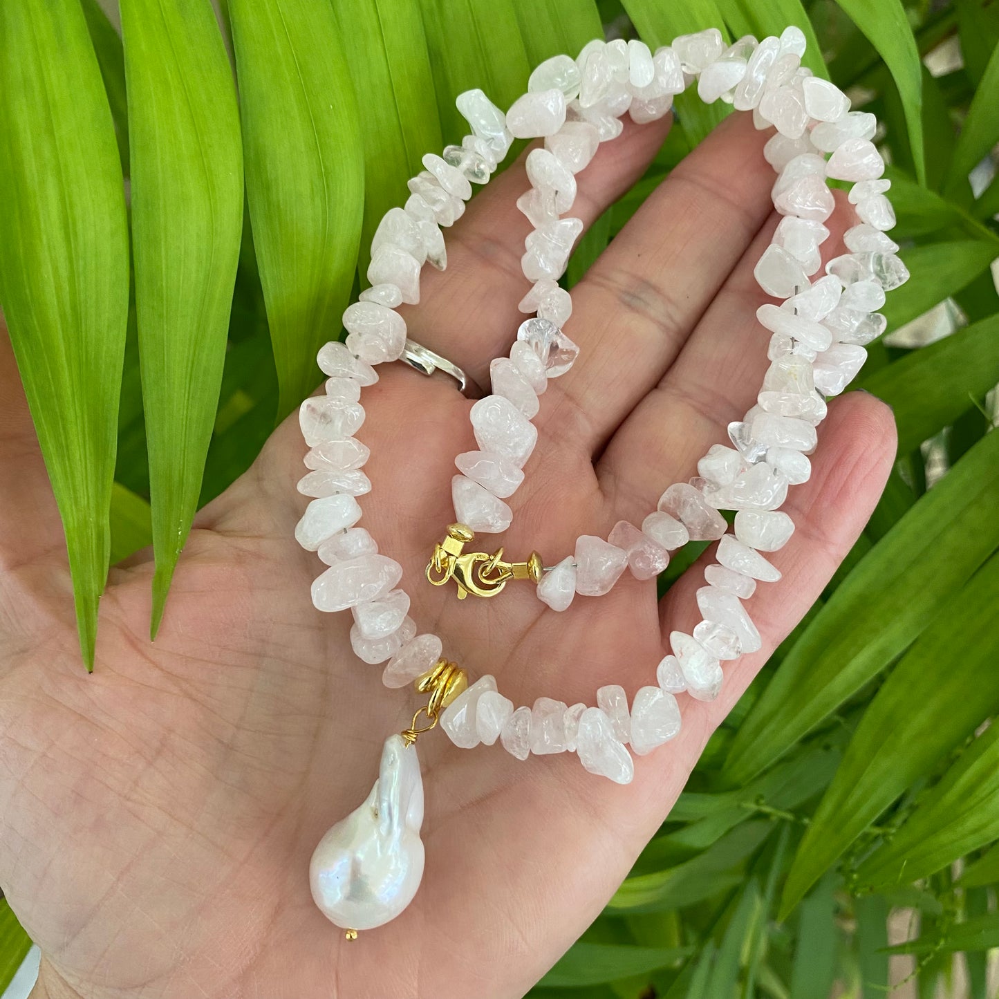 Rose quartz baroque pearl necklace showcasing pink nugget beads and a luminous baroque pearl pendant.