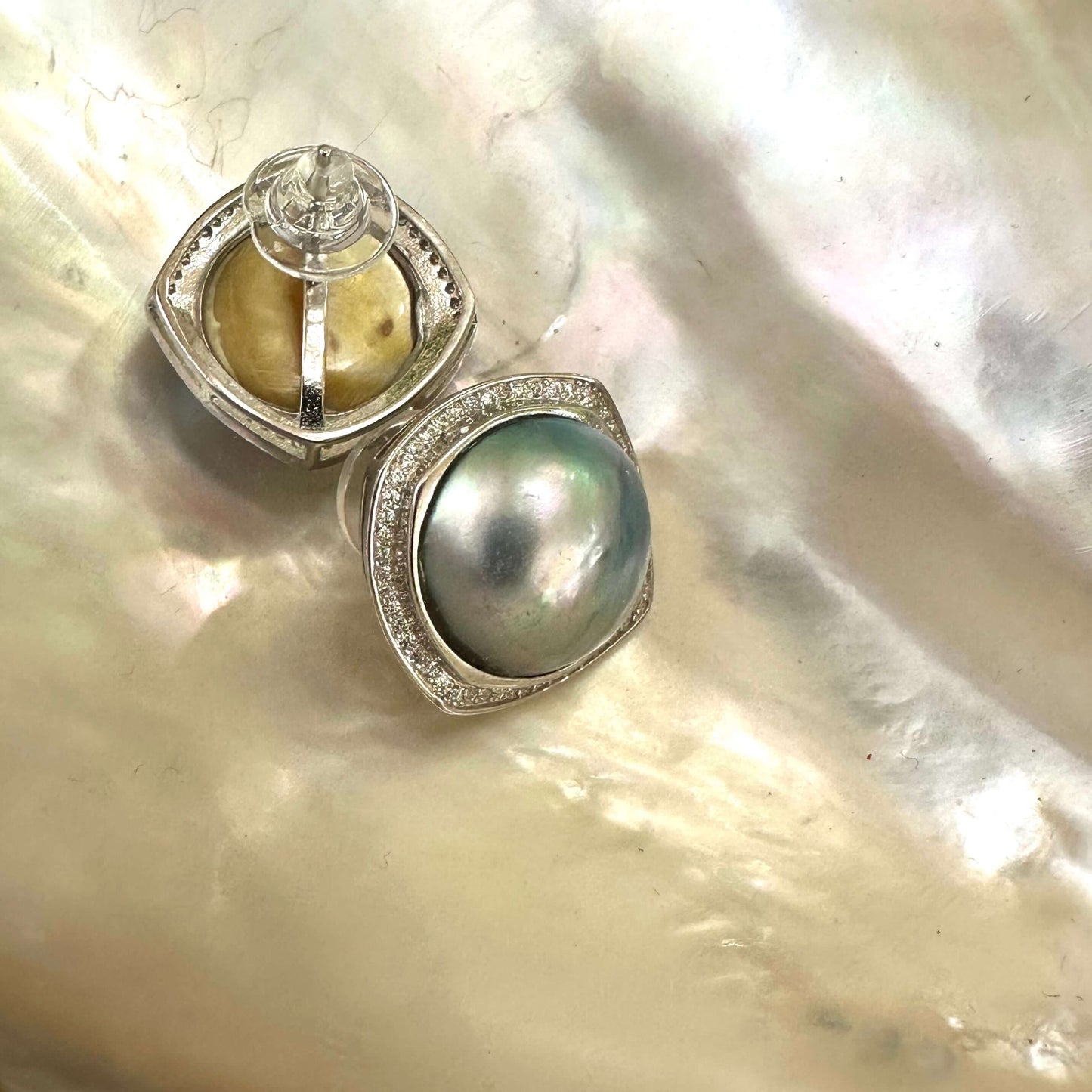 Mabe Pearl Earrings – back and front view shown on white pearl shell background