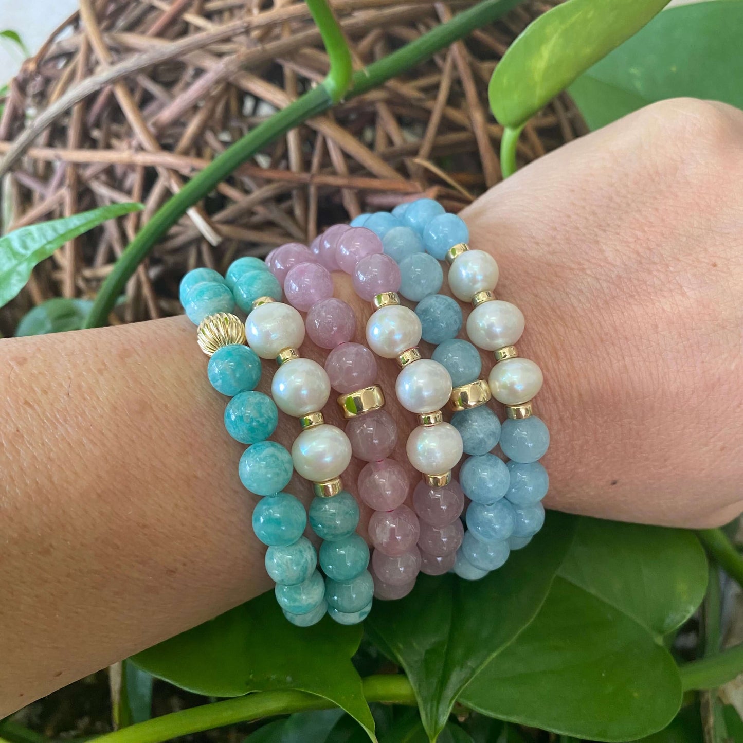 Amazonite freshwater pearl bracelet stacked on wrist showcasing colorful beads and pearls in a stretch design.