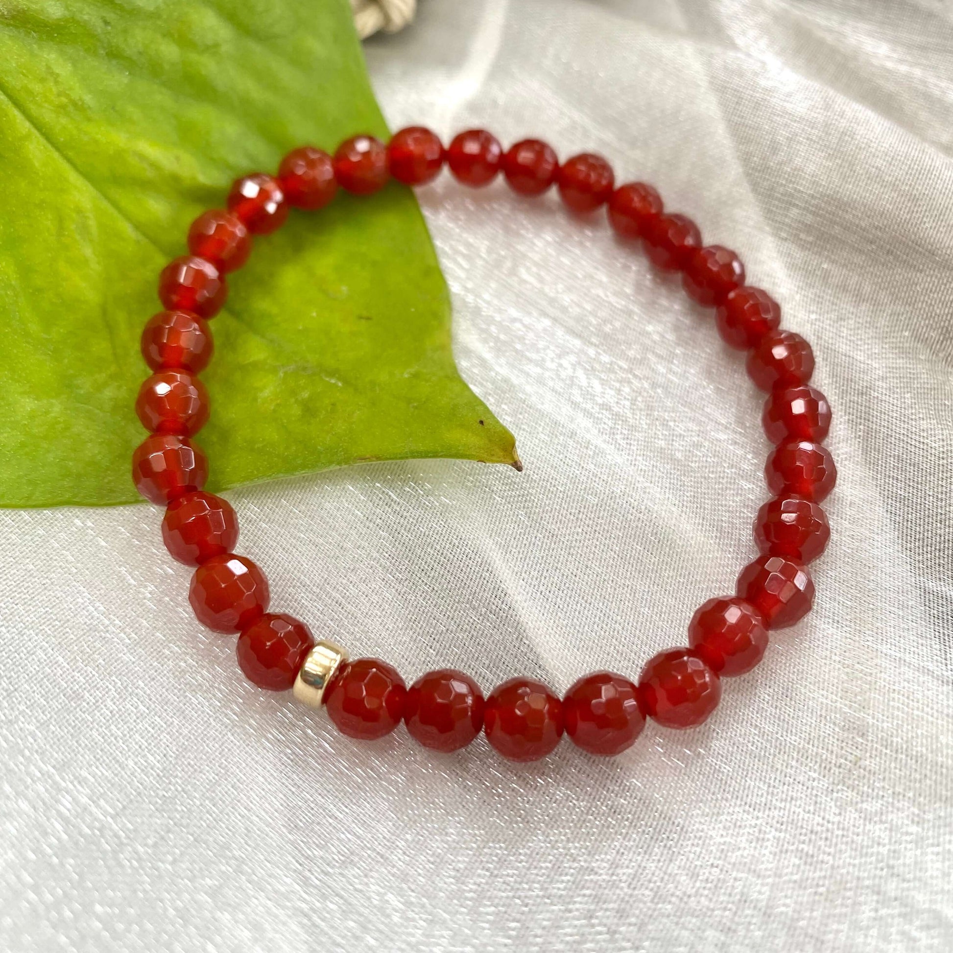 Red agate bracelet – 6mm beads in 14K gold filled showcasing vibrant red-orange tones and elegant craftsmanship.