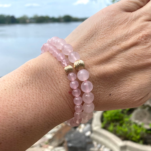 Rose Quartz Bracelet worn on woman’s wrist – stacked natural light shot