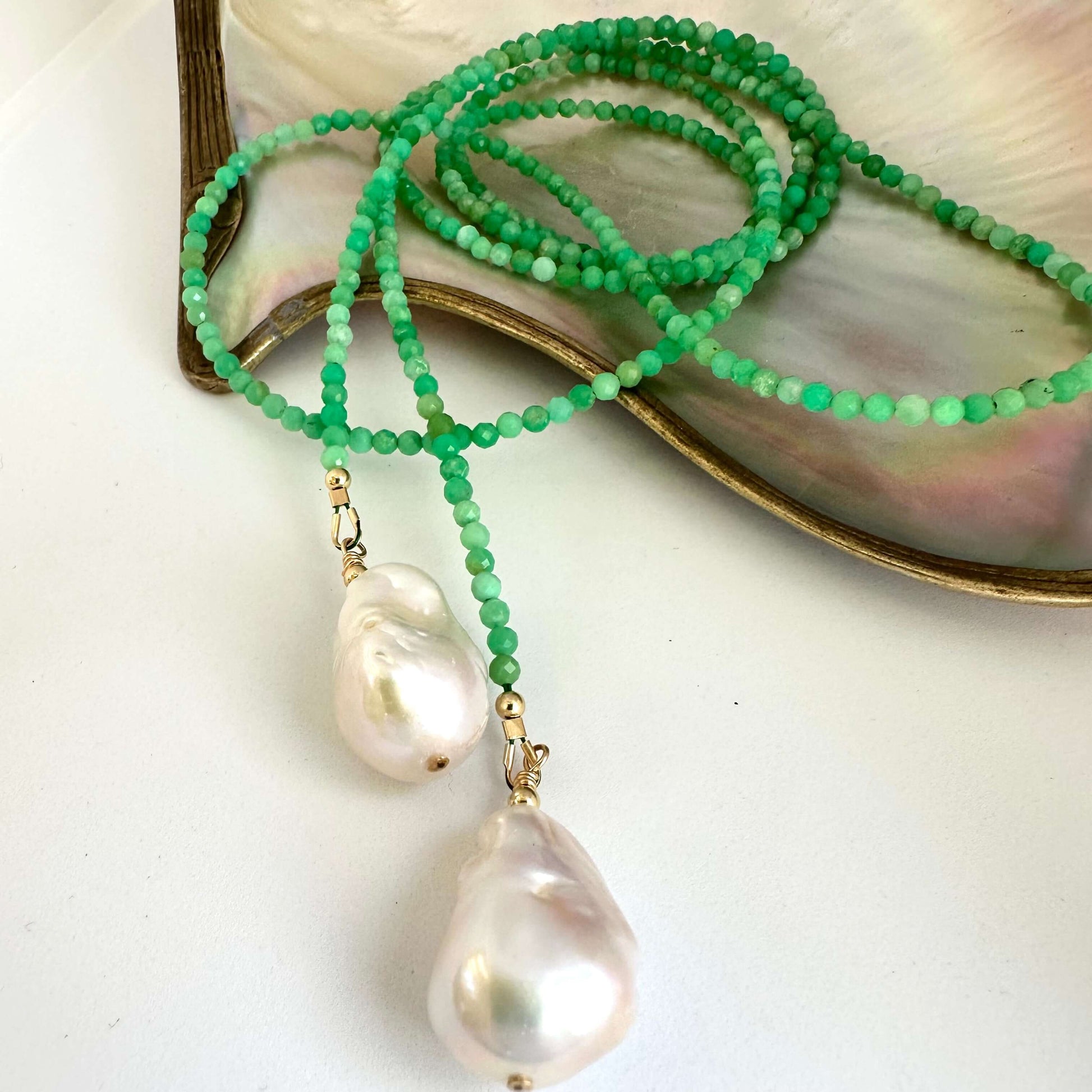 Close-up of Apple Green Chrysoprase Lariat Necklace on white background — faceted gemstones and baroque pearls handcrafted by Loulia Pearl Jewelry