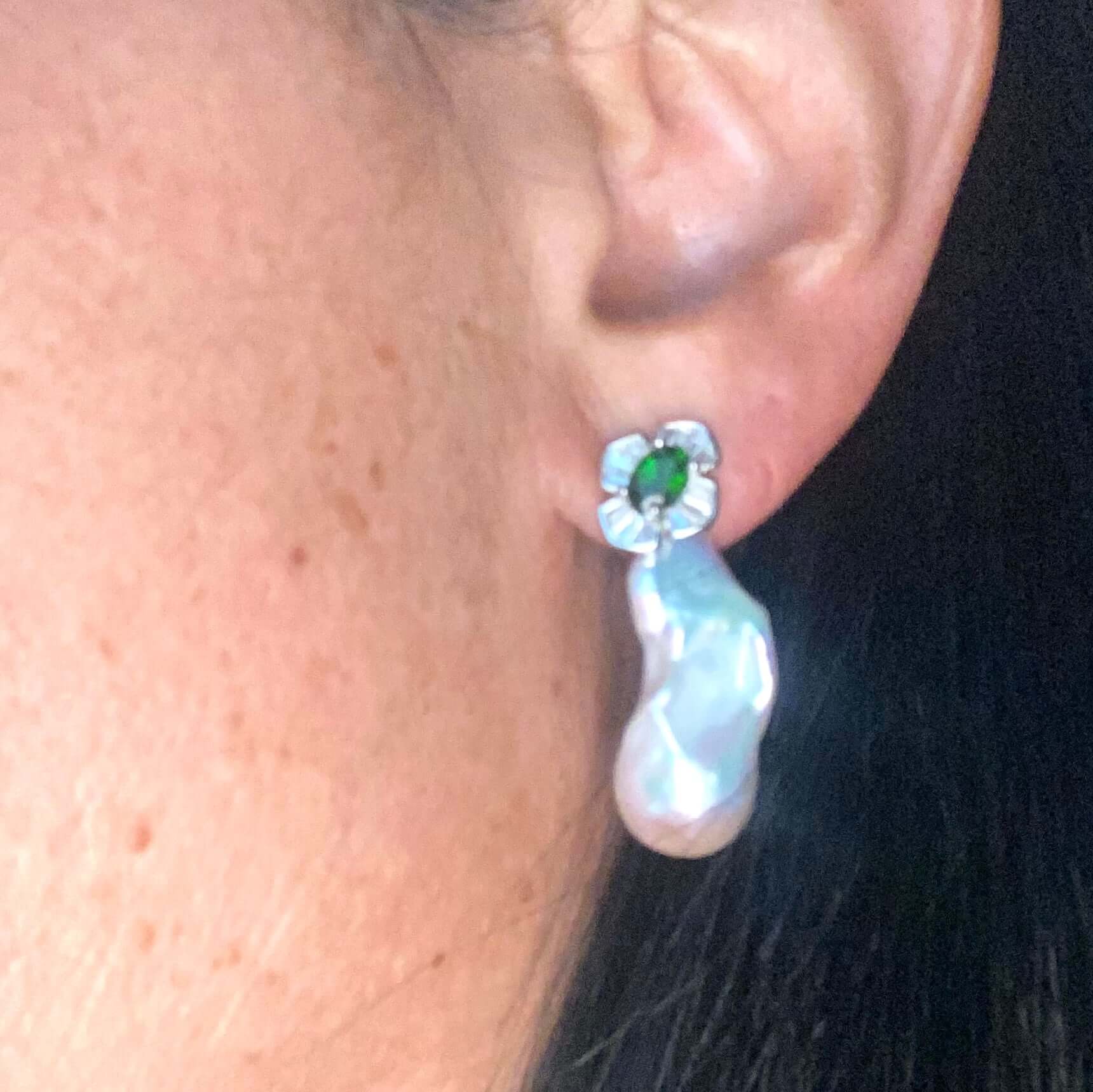 Green diopside baroque pearl drop earrings worn on woman’s ear — handcrafted gemstone and pearl jewelry by Loulia Pearl Jewelry