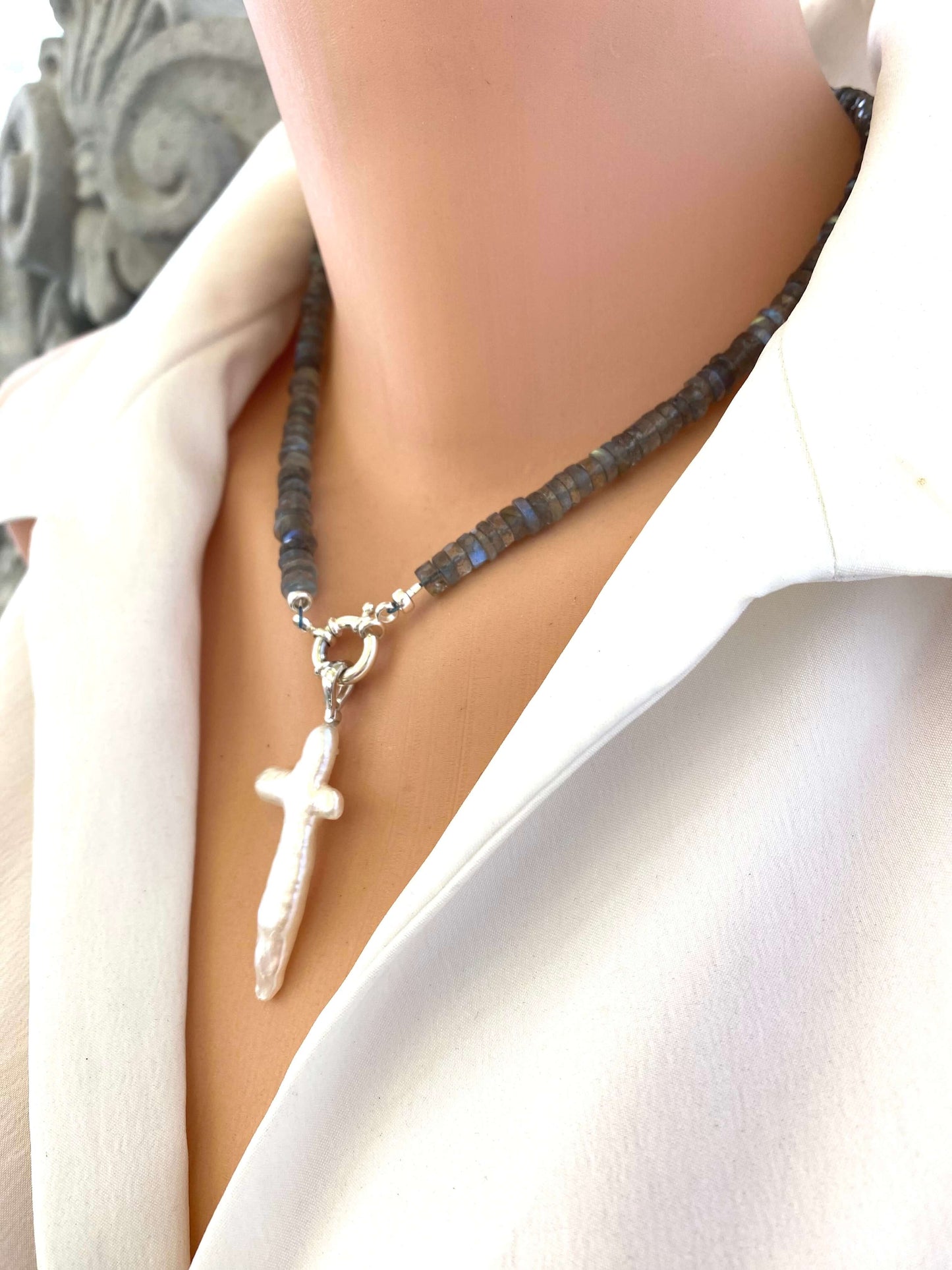 Side view of mannequin wearing labradorite aquamarine pendant necklace with baroque pearl cross — elegant handcrafted jewelry by Loulia Pearl Jewelry