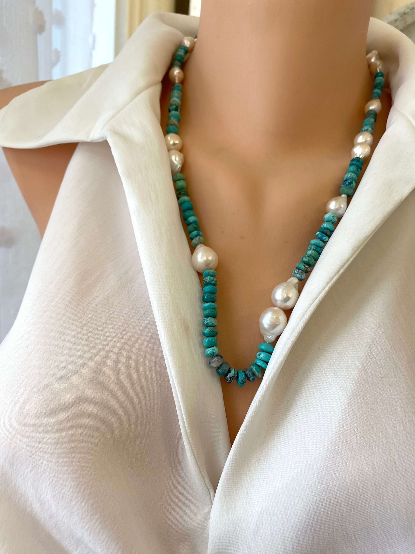 Arizona turquoise pearl necklace showcased on a mannequin, featuring turquoise rondelle beads and baroque pearls.