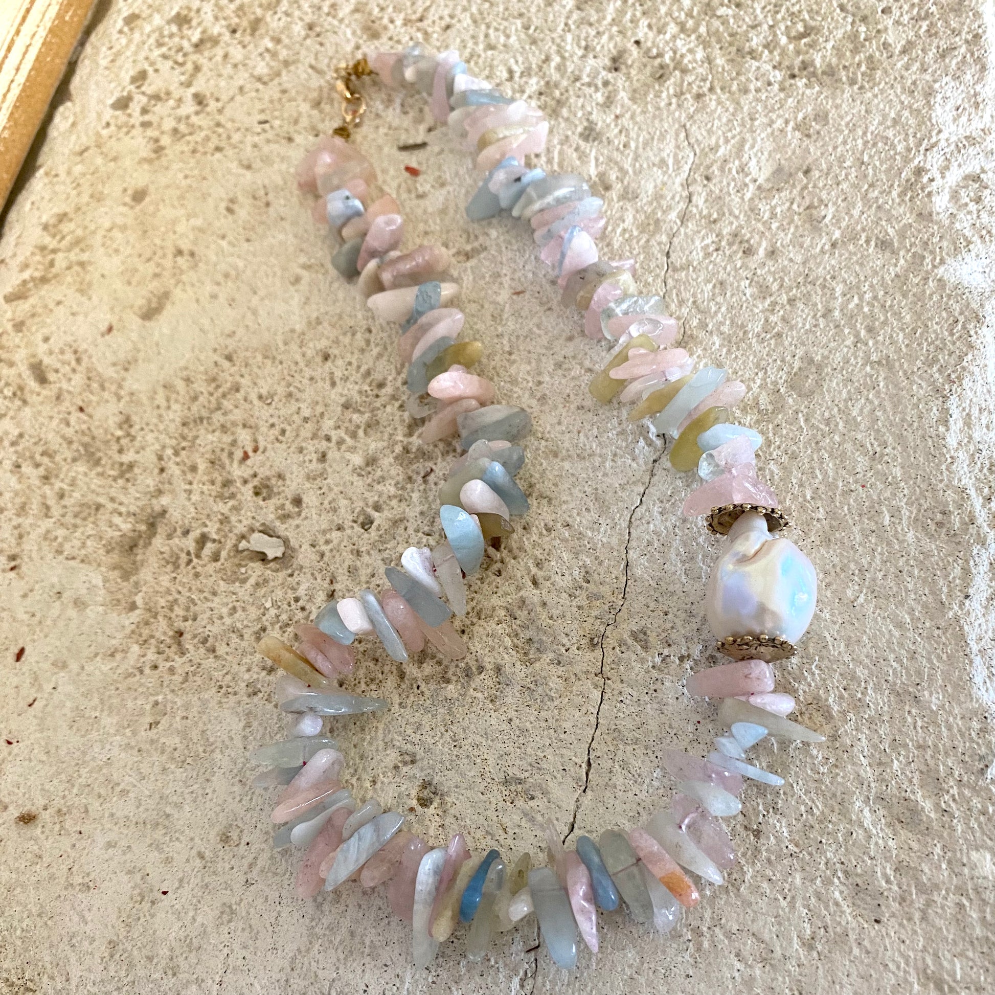 Morganite aquamarine necklace with baroque pearl, showcasing pastel gemstones and artisanal details.