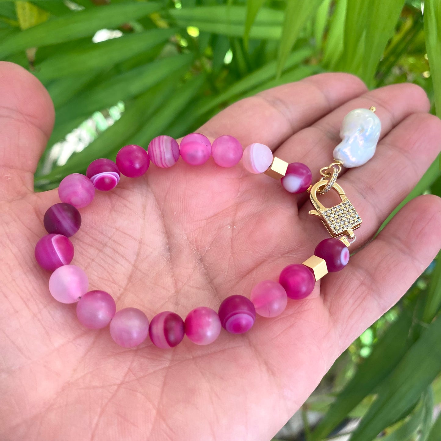 Sardonyx baroque pearl bracelet featuring hot pink beads and freshwater pearl charm