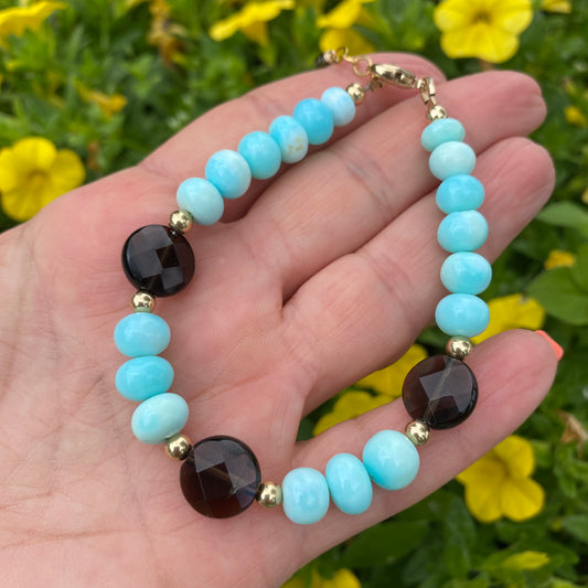 Opal quartz bracelet featuring sky blue opal and smoky quartz beads, handcrafted with natural elegance.