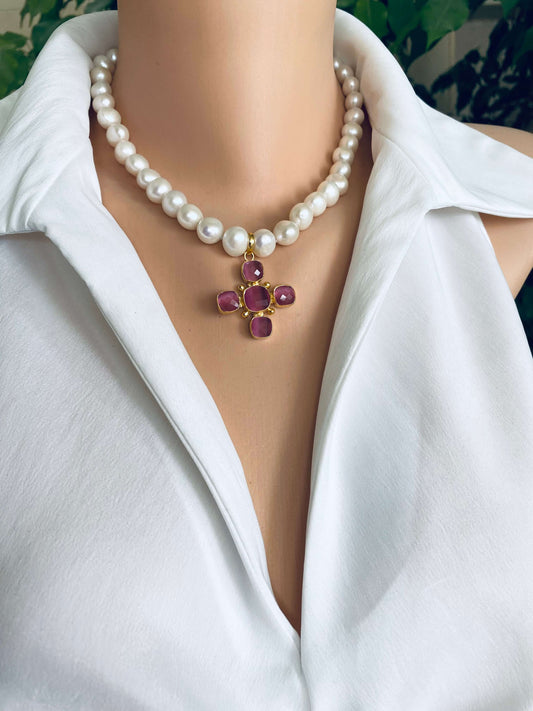 White potato pearl necklace with cross pendant showcasing white freshwater pearls and a pink gemstone cross centerpiece.