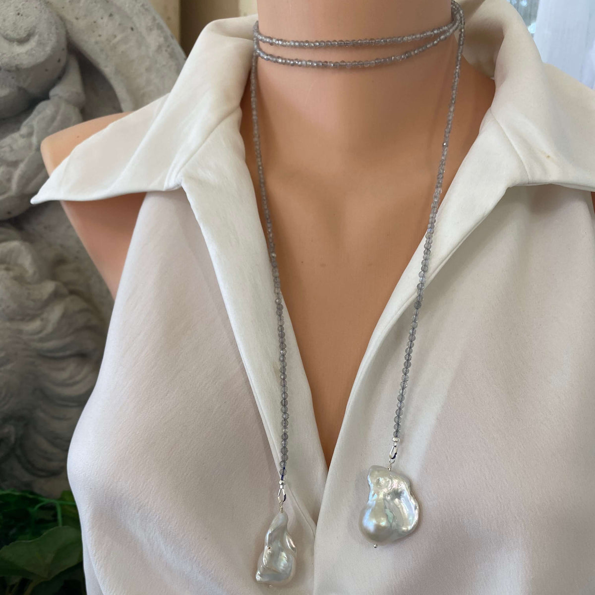 Labradorite and Baroque Pearl Necklace showcasing a lariat design on a mannequin, elegant and handmade by Loulia Pearl Jewelry.