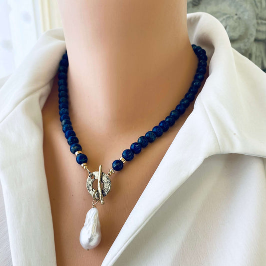 Lapis lazuli baroque pearl necklace worn on model with deep blue beads and pearl pendant