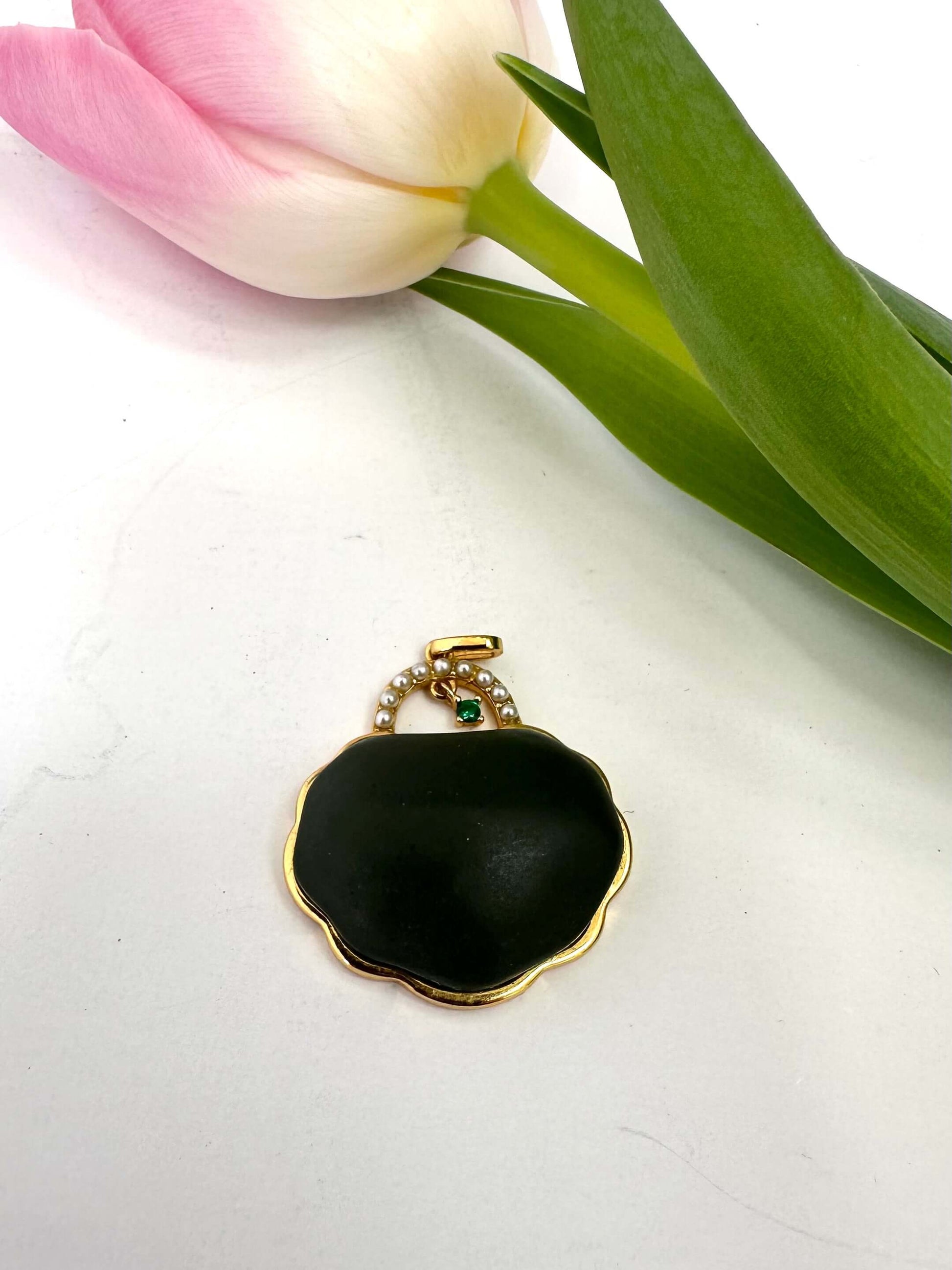Hotan jade purse pendant with pearl detail in gold vermeil, shaped like a miniature purse with a matte finish.