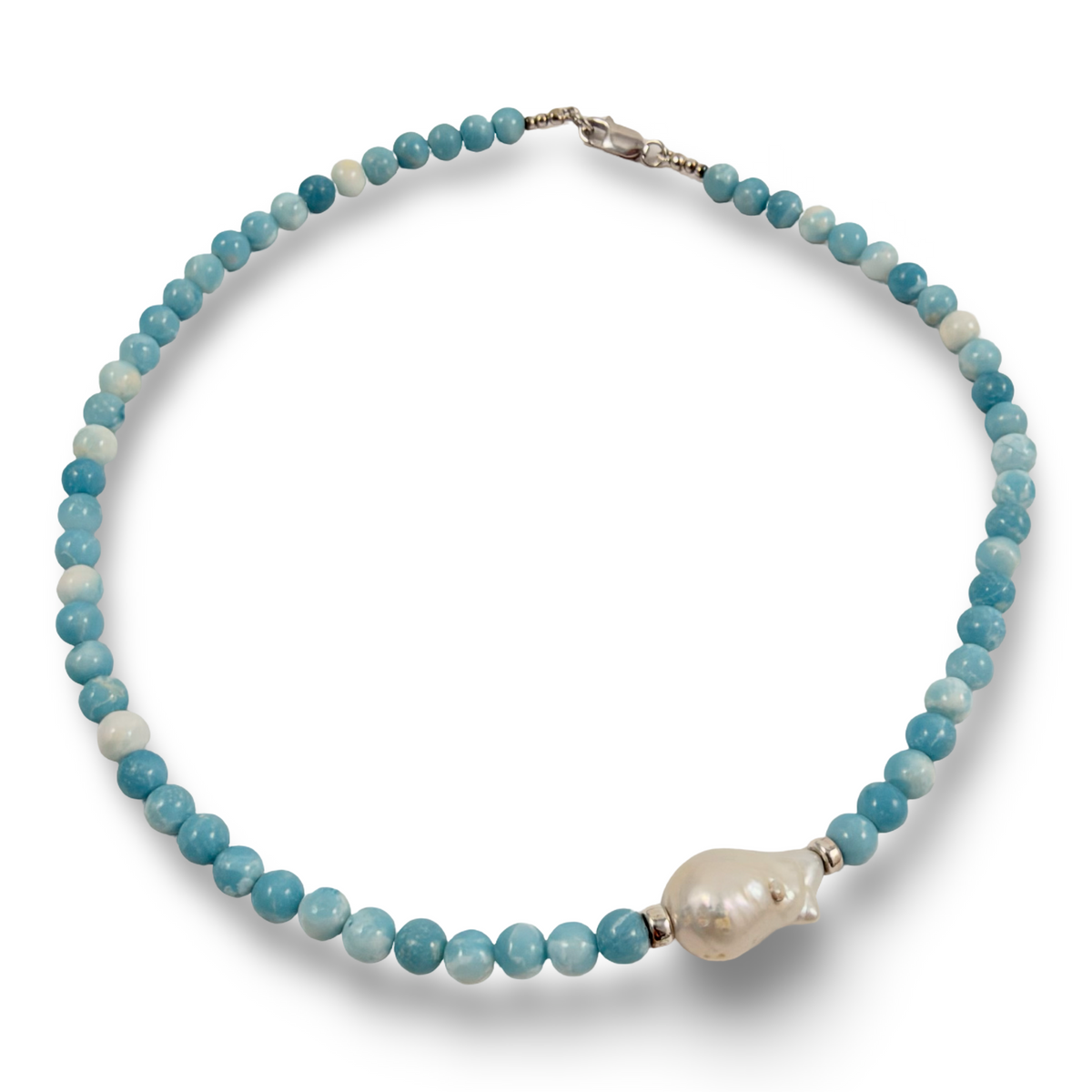 A beaded necklace featuring light blue and white round beads, accented by a large, irregular white pearl pendant and silver-toned metal clasp, shown on a plain white background.