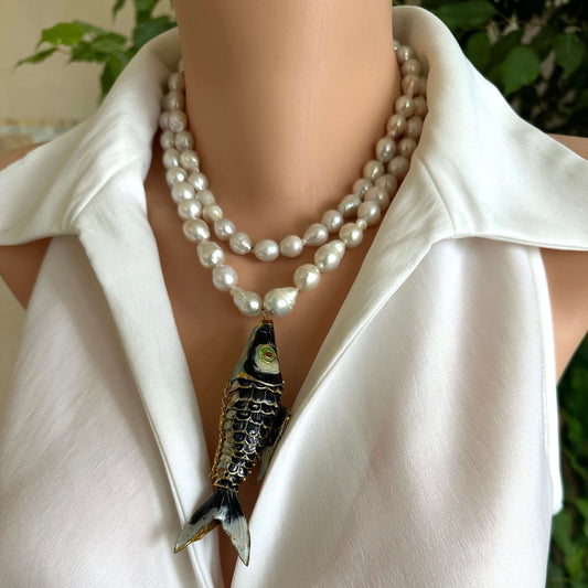 Fish pendant pearl necklace featuring a large cloisonné fish pendant and hand knotted baroque pearls.