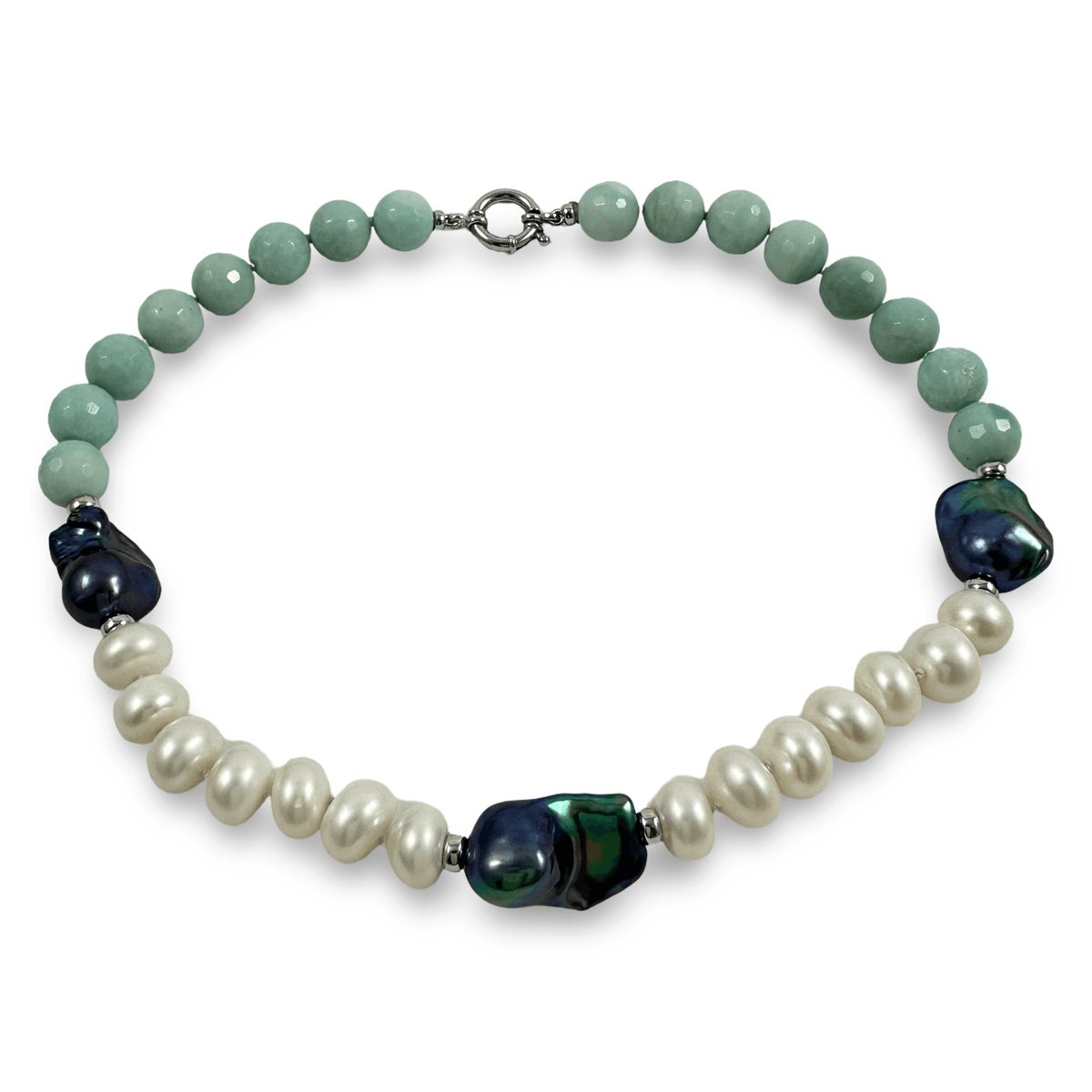 A beaded necklace featuring light green faceted beads, white baroque pearls, and dark iridescent cabochon beads, completed with a silver-toned clasp on a white background.