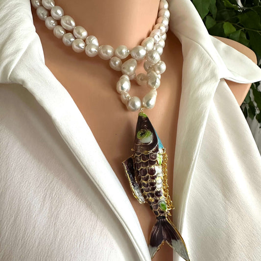 Koi fish pearl necklace with baroque pearls, showcasing a burgundy cloisonné koi fish pendant on a model.