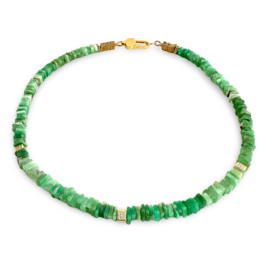 A green stone beaded necklace with irregular, chunky disc-shaped beads in various shades of emerald and mint green, accented with small gold spacer beads and a gold lobster clasp, shown on a plain white background.