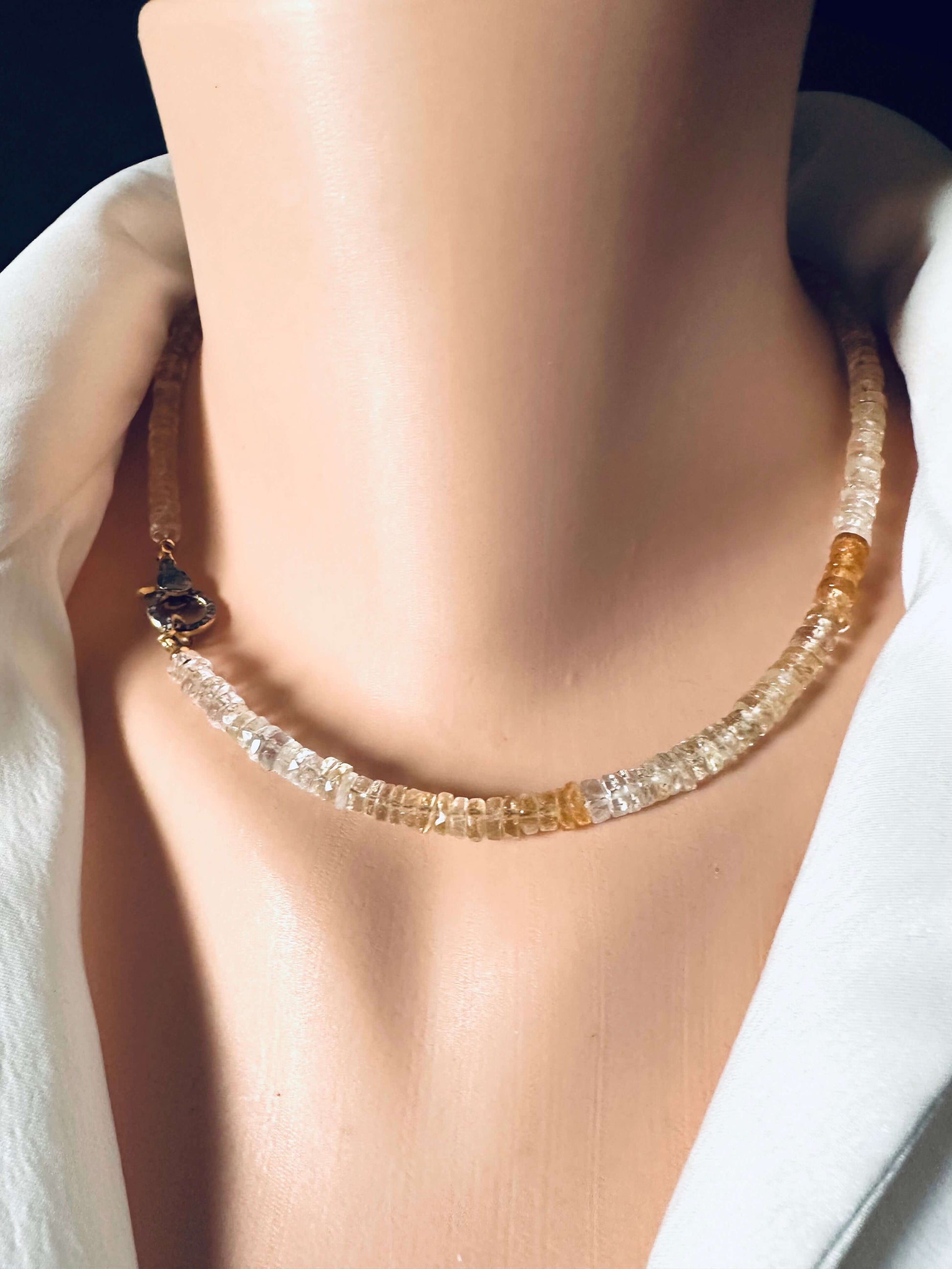 Shaded citrine gemstone necklace featuring faceted stones with warm golden hues, gold vermeil clasp, elegant and handcrafted.