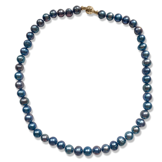 A single-strand pearl necklace featuring dark, iridescent blue and purple pearls with a small gold clasp, displayed on a clean white background.
