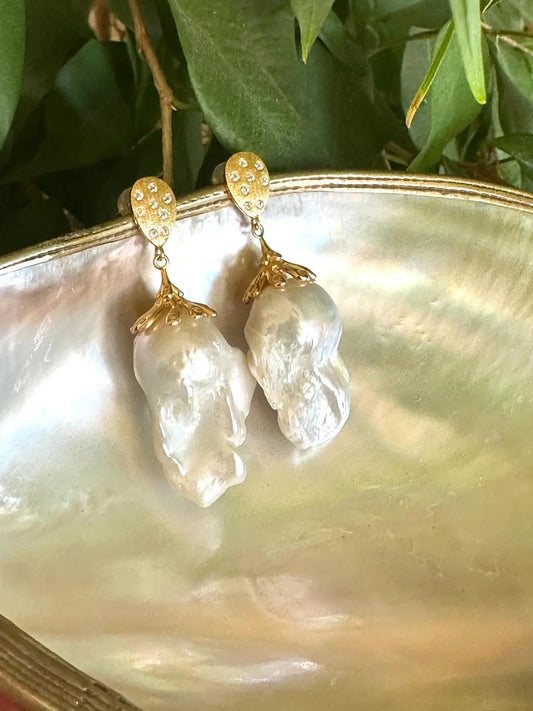 Baroque Pearl Gold Vermeil Earrings photographed with green leaves — gold vermeil and baroque pearls handcrafted by Loulia Pearl Jewelry