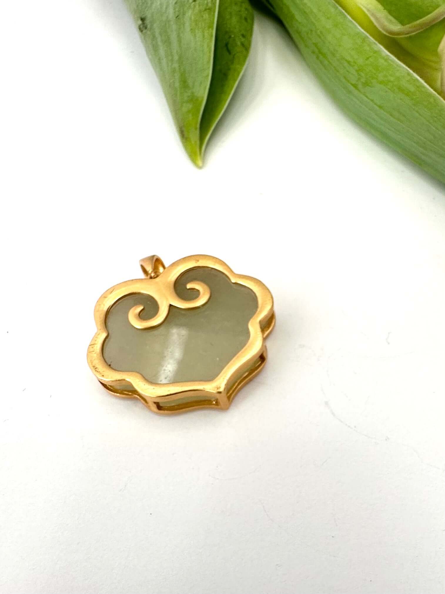 Hotan jade pendant in gold vermeil showcasing natural nephrite charm with elegant design.