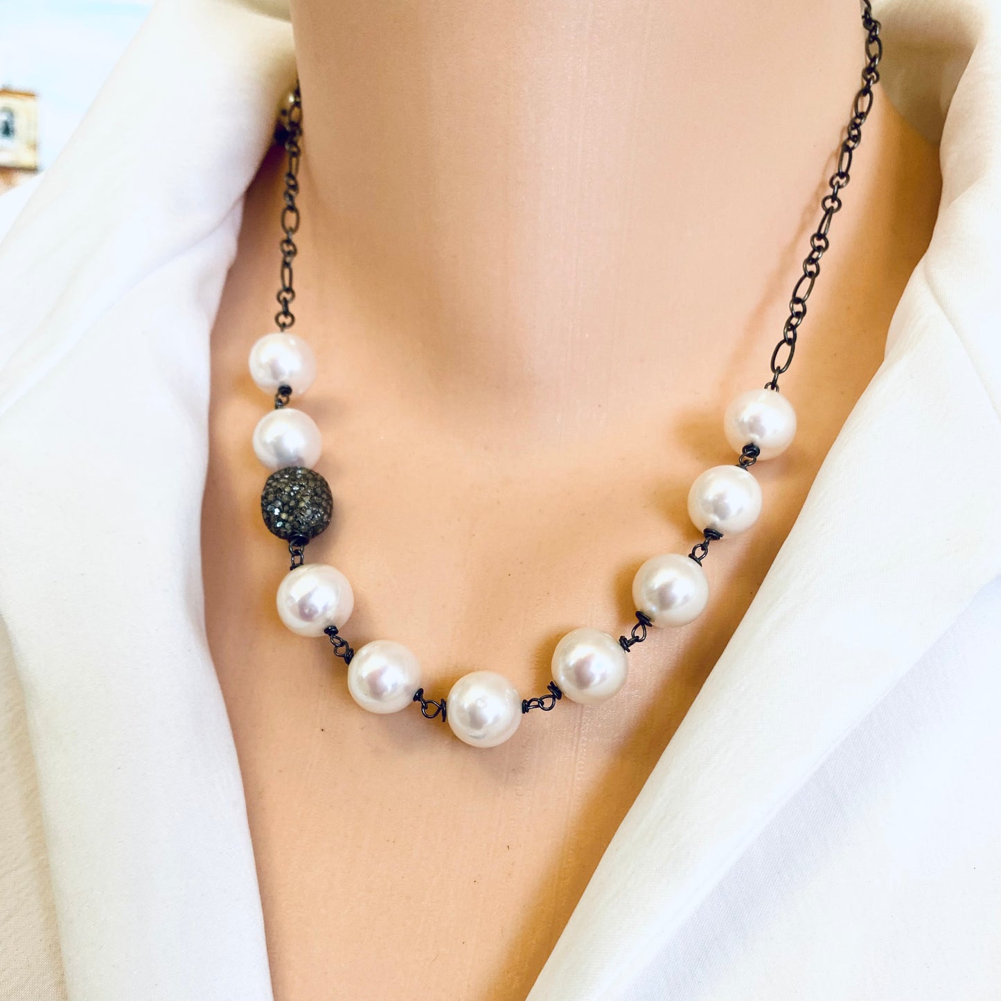 Handmade pearl necklace wire wrapped in silver with oxidized silver bead, created in Canada.